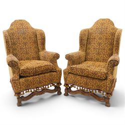 Pair of William & Mary design wingback armchairs, the arched high-back over rolled arms wi...