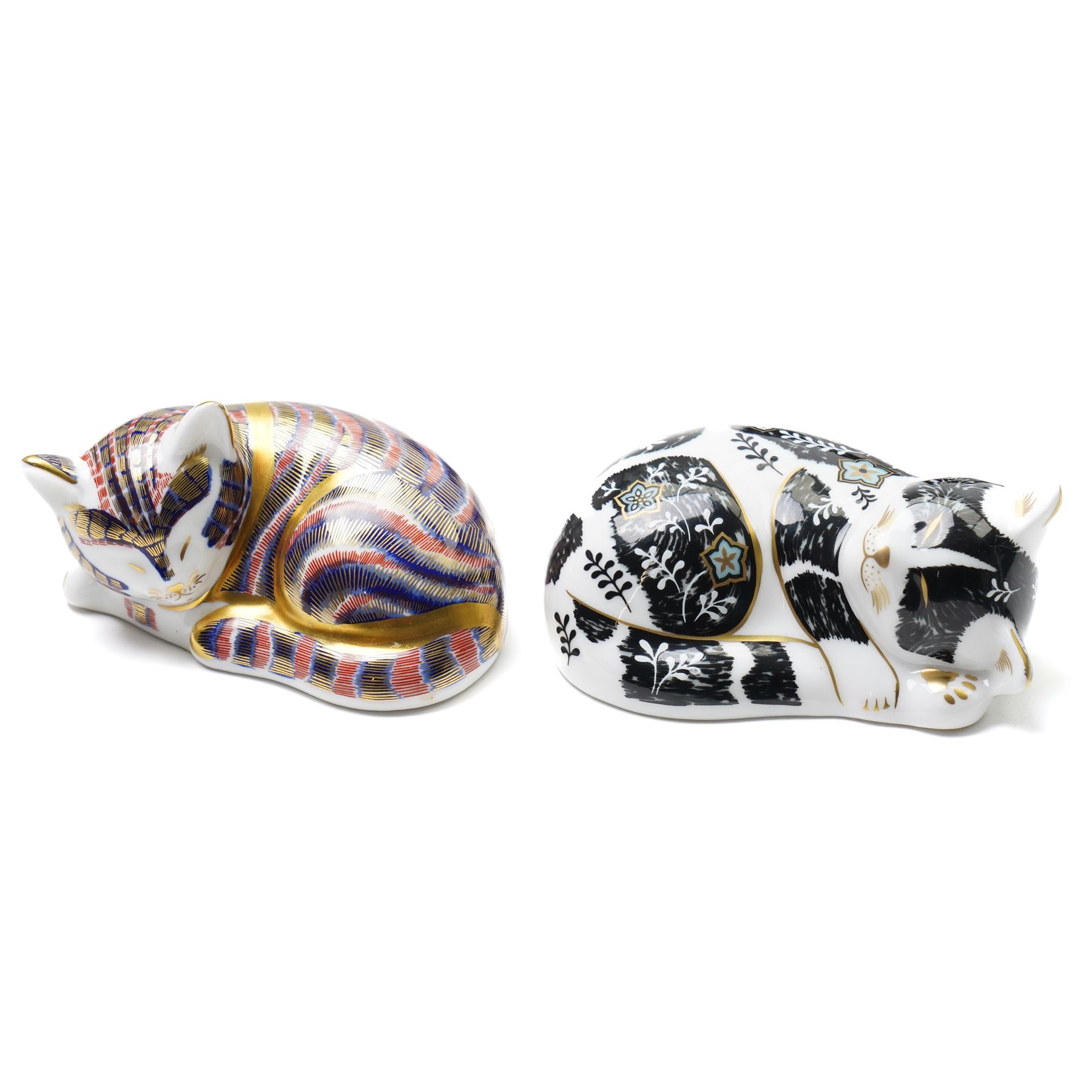 Six Royal Crown Derby paperweights, comprising 'Misty' collectors cat with gold stopper, Sleeping Cat with silver stopper, Fireside Kitten with gold stopper, Thomas Silver Tabby Kitten with gold stopper, Tabitha Silver Tabby Kitten with gold stopper, Cottage Cat with gold stopper, four with boxes (6)