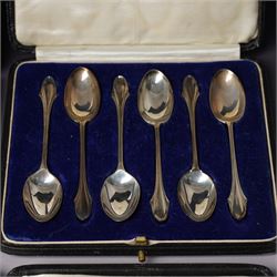 Set of six silver coffee spoons with shaped terminals, cased London 1924, another set of similar spoons London 1924 cased and a set of six silver bead knop spoons Birmingham 1936, cased