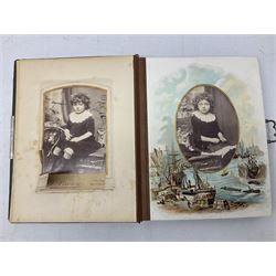 Victorian desk ink blotter, decorated with painted spray of flowers within stylised gilt rococo spandrels with mother of pearl fixings, together with a Victorian photo album containing interior leaves with apertures of various sizes and shapes of portraits surrounded by printed sea and dock scenes, blotter L28cm