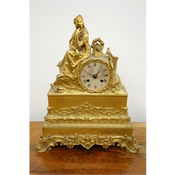  Late 19th century French gilt metal figural mantel clock with seated female figure and circular silvered dial, modern movement, H38cm  