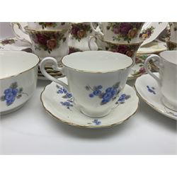 Royal albert Country Rose tea set for six, comprising teacups, saucers, dessert plates, cake plate, covered sucrier and milk jug, together with another tea set  