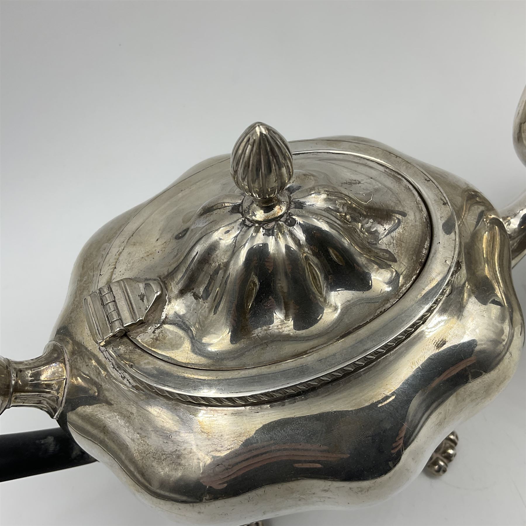 Five piece Edwardian silver tea service, comprising teapot and coffee pot, each with ebonised scroll handle, tea caddy with hinged cover, twin handled open sucrier, and milk jug, each of rounded bombe form, upon four paw feet, hallmarked William Adams Ltd, Birmingham 1904 and 1905, coffee pot H26cm
