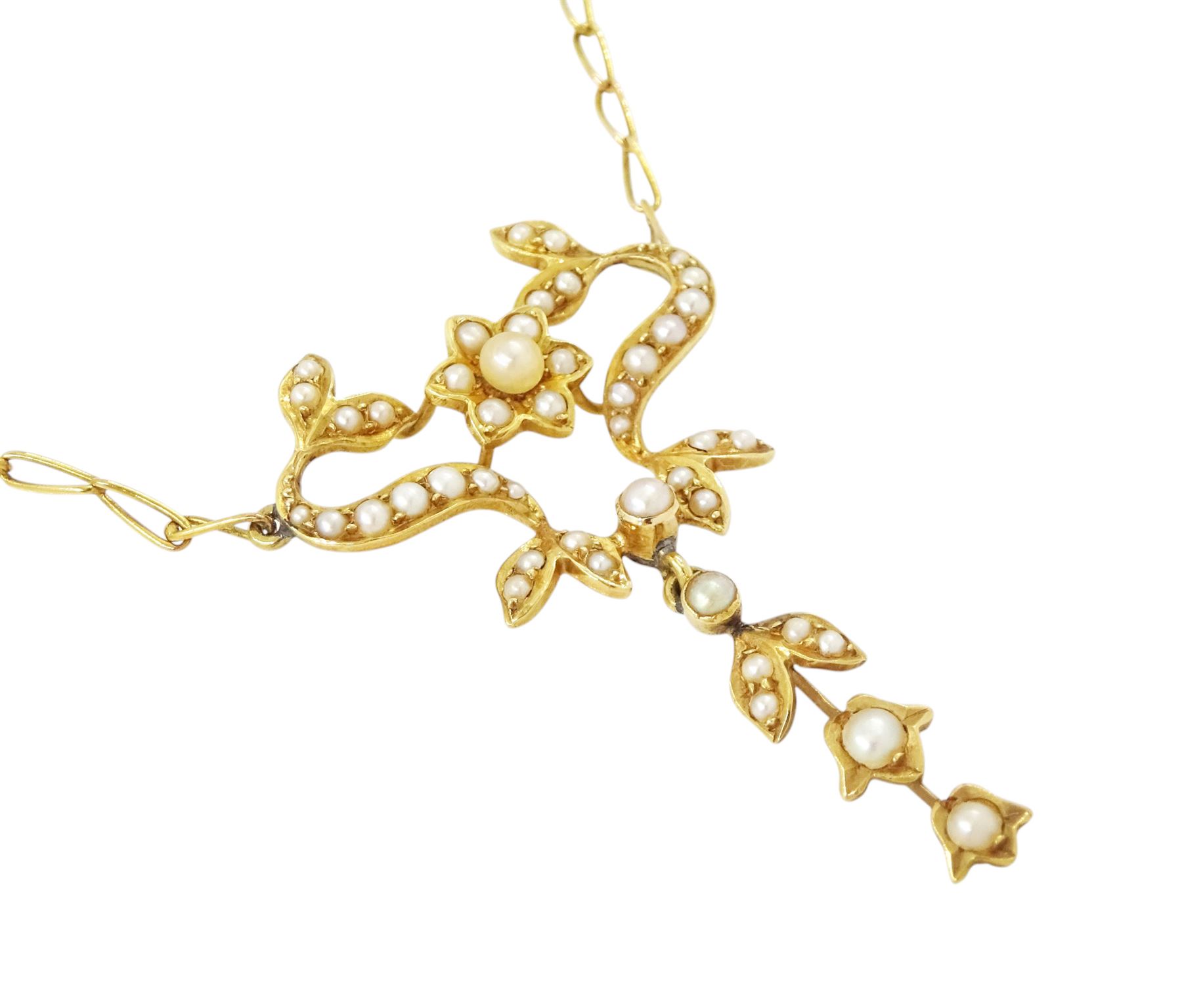 Edwardian gold split pearl pendant necklace, openwork floral pendant set with split pearls on a fancy link chain necklace