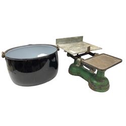Set on cast iron scales and weights, together with an enamelled pot with handle 