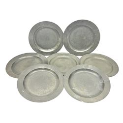 Group of seven 19th century pewter chargers, each of circular form with dished centre, two examples with touch marks verso, each approximately D39cm