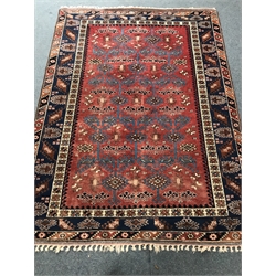 Turkish red and blue ground rug, geometric patterned field, repeating border, 272cm x 202cm