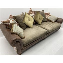 Alexander James - Grand two sectional sofa upholstered in studded leather and fabric, with contrasting kilim patterned scatter cushions, scrolling arms and turned front supports 