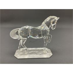 Five Swarovski Crystal horses, comprising stallion, rearing horse, pair of horses playing and Arabian stallion, each with frosted manes and tails, together with a small Swarovski Crystal galloping horse, the mane, tail and base with smoky tint