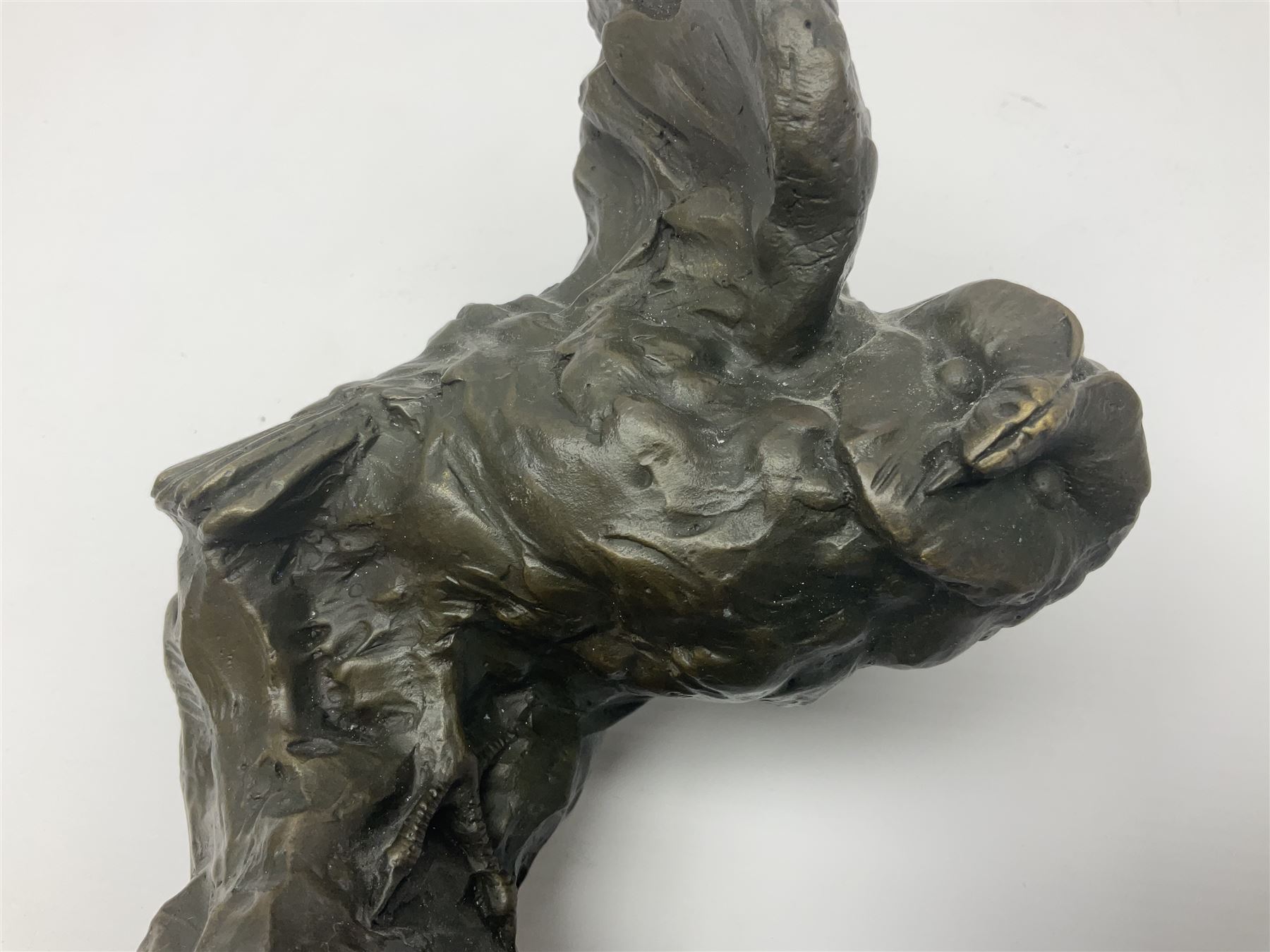 Bronze figure, modelled as an owl upon a rock, on stepped circular base, after Milo, H24.5cm