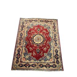Large Persian red ground rug, central medallion, floral field, repeating boarder