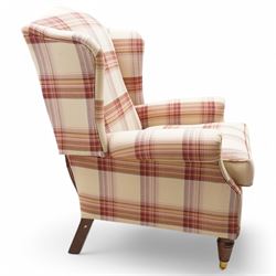 Laura Ashley - hardwood-framed wingback reclining armchair upholstered in checkered fabric, on turned and fluted front feet with brass cups and castors 