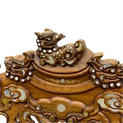 Pair of Chinese hardwood throne chairs, the back with grey marble inset surrounded by carved dragons and masks, inlaid with mother of pearl, the arm terminals carved with dragons, panelled seats inlaid with flowers and foliate motifs, on ball and claw carved cabriole feet