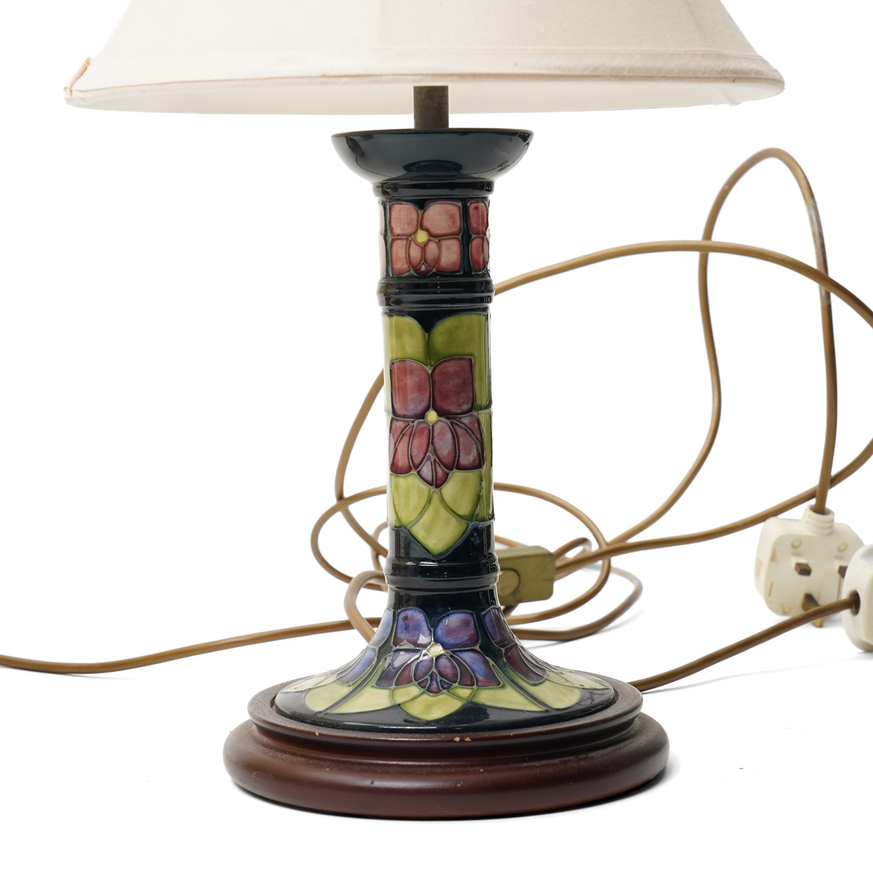 Three Moorcroft lamps in the Violet and Hibiscus patterns, two with shades, largest including shade H46 (3)