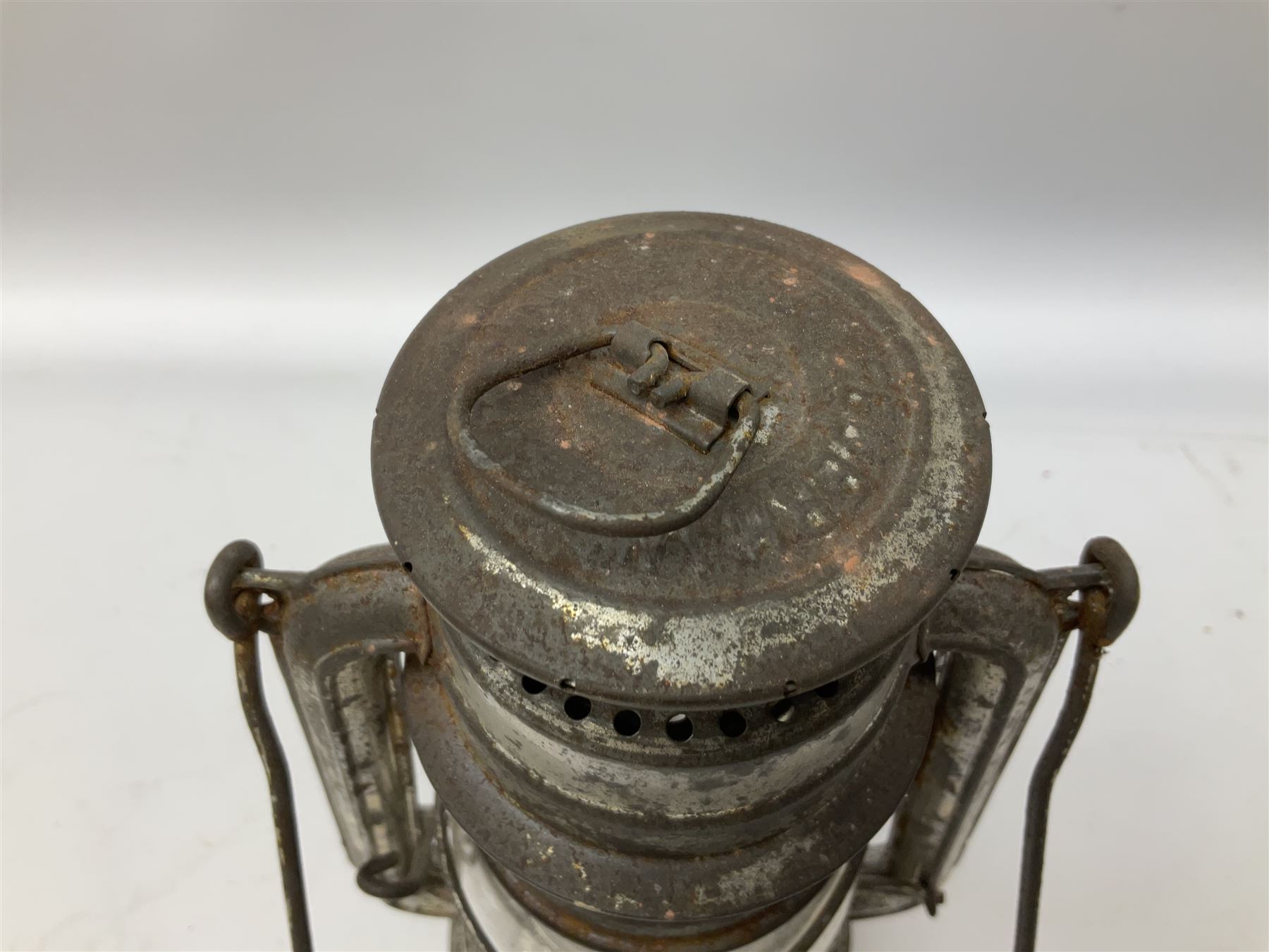 Copper and brass ship’s lamp marked ‘Anchor’, H25cm, Feuer hand storm lantern, Bialaddin Model 315 paraffin lamp and an Anchor lamp (4)