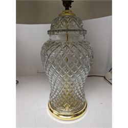 Ceramic table lamp of baluster form decorated with flowers on a burgundy ground, together with a glass lamp 