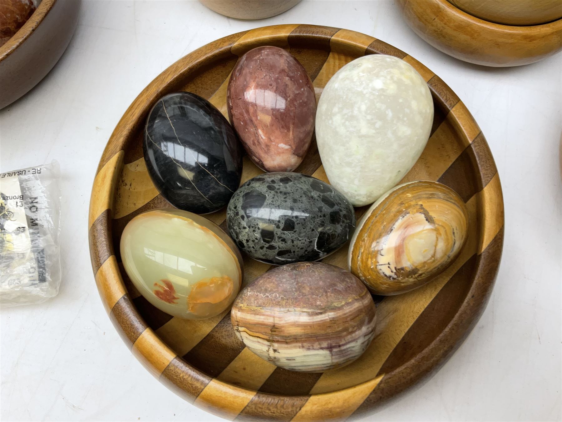 Quantity of cigarette cards to include three frames, and quantity of marble and agate eggs, turned wood bowls etc