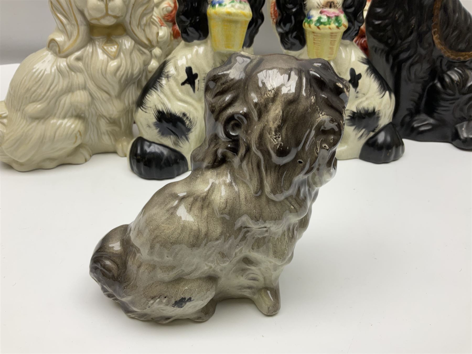 Two Pairs of Staffordshire style dogs, together with three other examples, largest example H27cm