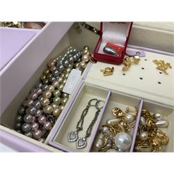Cultured pearl jewellery comprising of eleven necklaces and seven bracelets, with a collection of costume jewellery including simulated pearl bracelets by Kenneth Jay Lane and a selection of Kirks Folly earrings, presented in a modern jewellery box 