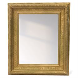 Two late 20th century gilt mirrors, foliate and dart detailing to the frame (H 92cm, W 66cm; H 53cm W 45cm)