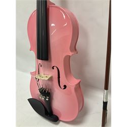 Zest full size pink violin, with a solid wood body and maple head, with matching pink bow and two further bows, in a hard case Length 60cm