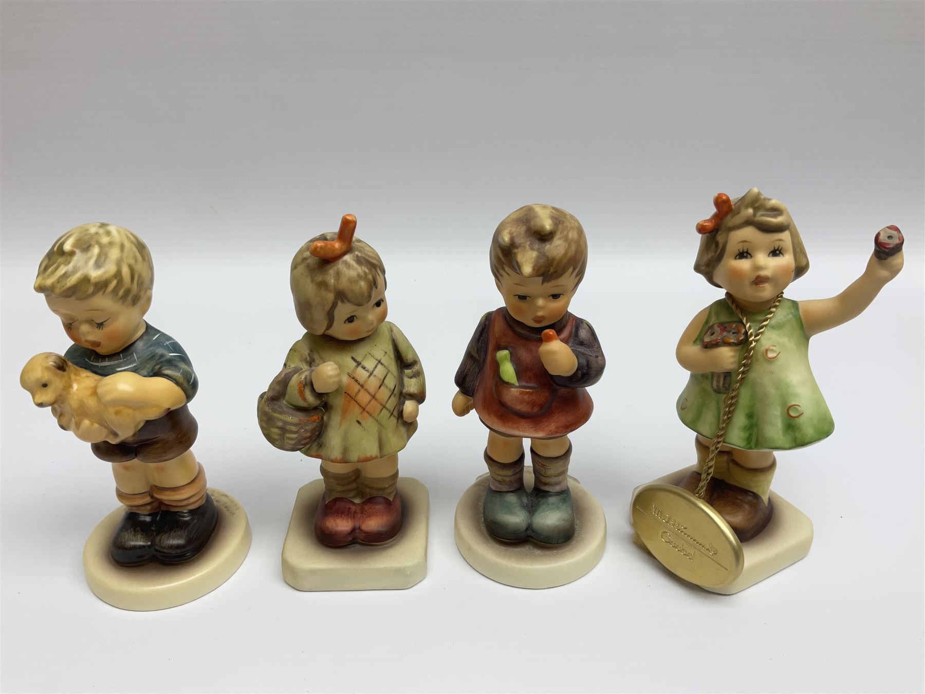 Twenty five Hummel figures by Goebel, to include Tuning up, Blessed Event, Book Worm, The Little Architect etc 