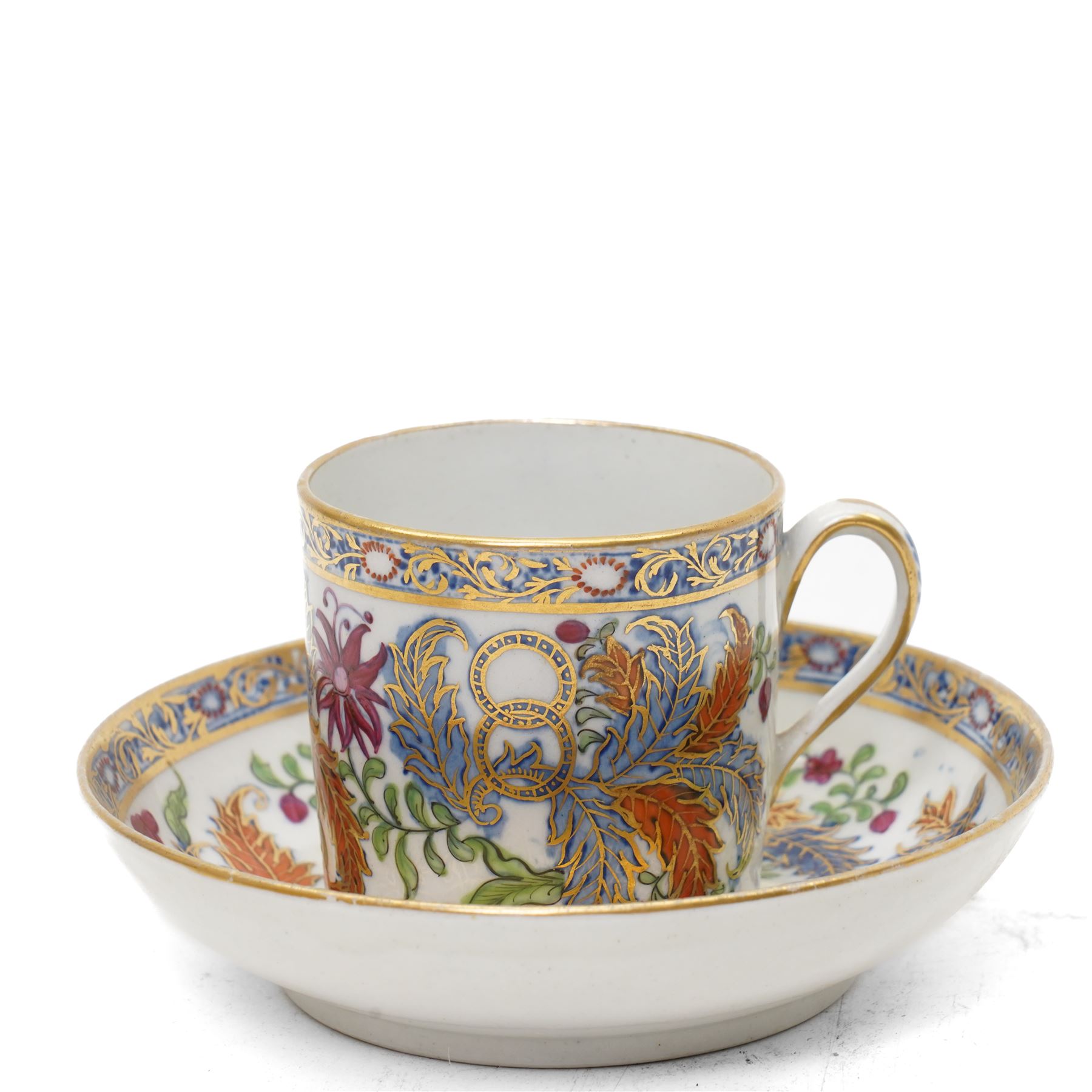 New Hall part tea and coffee service richly decorated  with a Tobacco Leaf design in pattern 274 comprising nine tea cups, eight coffee cans, ten saucers, tea pot and stand, sucrier and cover, slop bowl, milk jug and plate, circa 1800