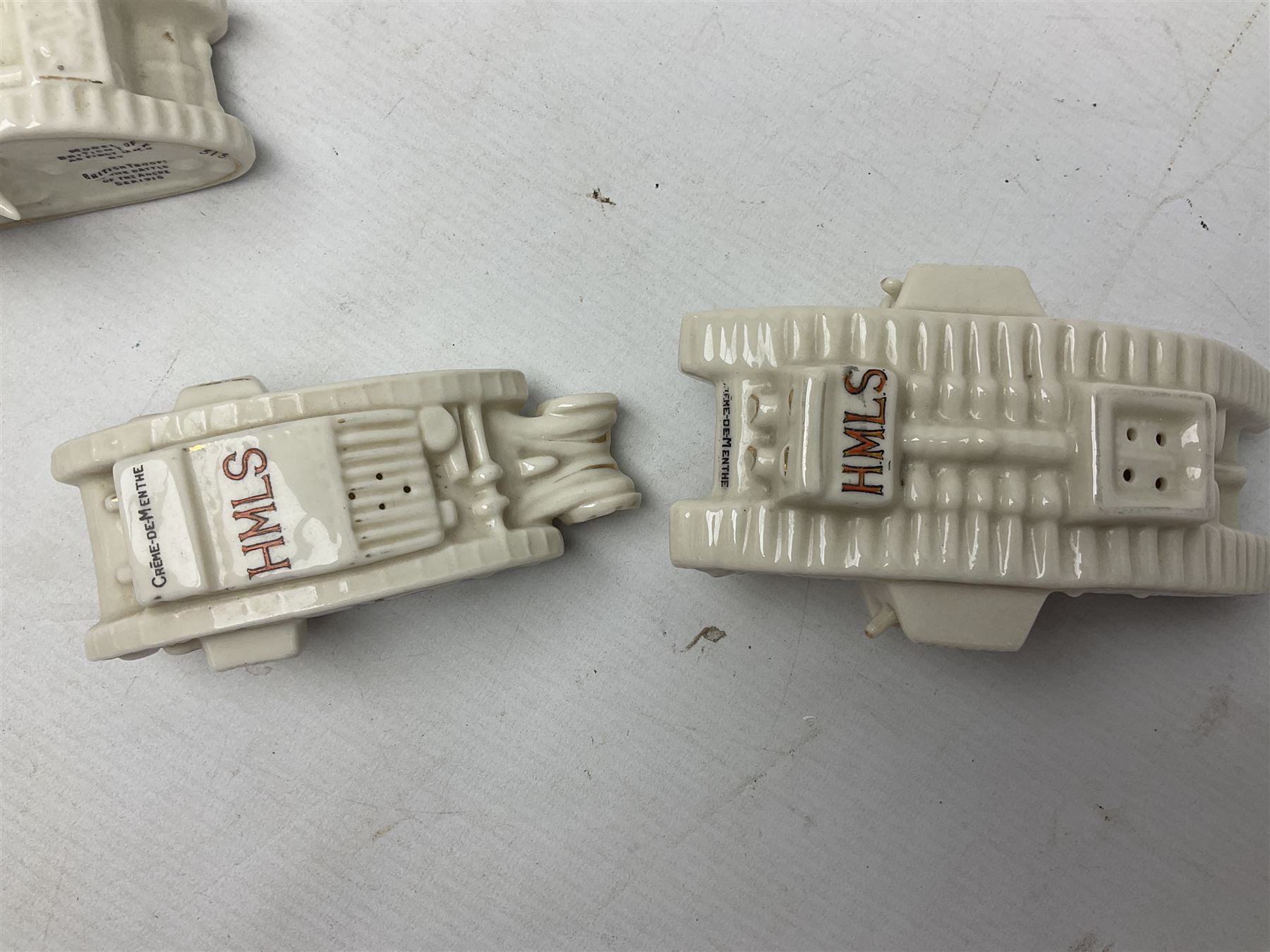 Twelve crested china models of WW1 tanks by Grafton, Arcadian and Carlton china etc with crests from Caistor Lincs, Saffron Walden, Paignton, Evesham etc  , together with a crested china model of the R.M.S Lusitania with New Brighton crest and a two-handled vase for 'The Forts Boxhill' (14)