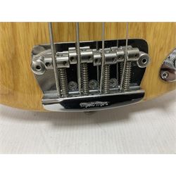 Ernie Ball Music Man Sting Ray 4 string bass guitar, in natural finish with roasted maple neck and tortoiseshell effect scratch guard, serial no 87485, in black Music Man hard case, guitar L114cm