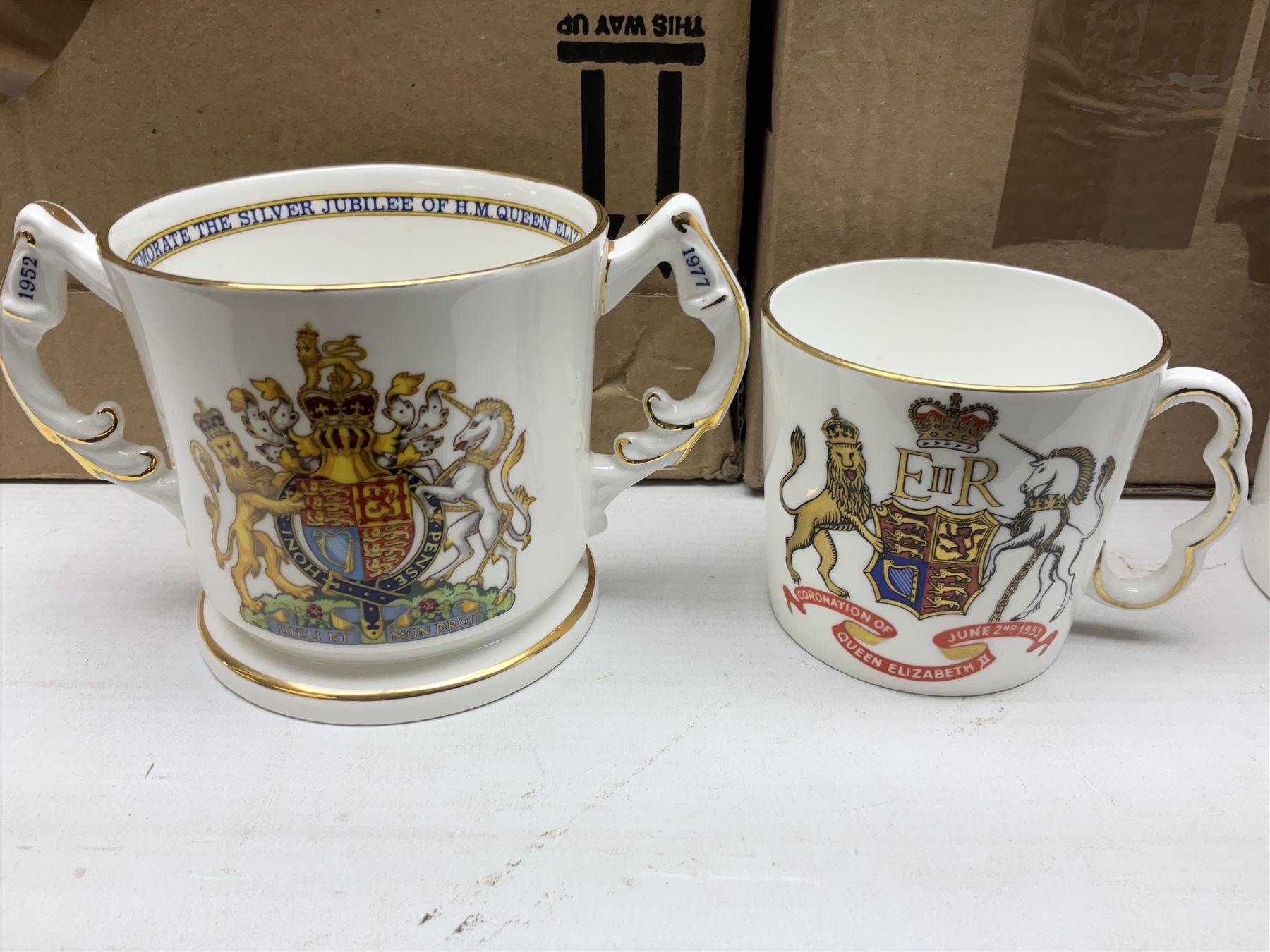 Collection of Victorian and later commemorative mugs, to include Queen Victoria 1887 Jubilee cup, Rd No. 64761, Royal Doulton Victory and Peace mug, 1919, Rd 666159, Royal Doulton King Edward VII blue transfer coronation, Royal Doulton 1937 George Coronation, Harrods Limited Rulers Of An Empire on Which The Sun Never Sets, Royal Worcester Victory in the Gulf, two Shelley examples, Spode limited edition Queen Elizabeth II Golden Jubilee etc in two boxes