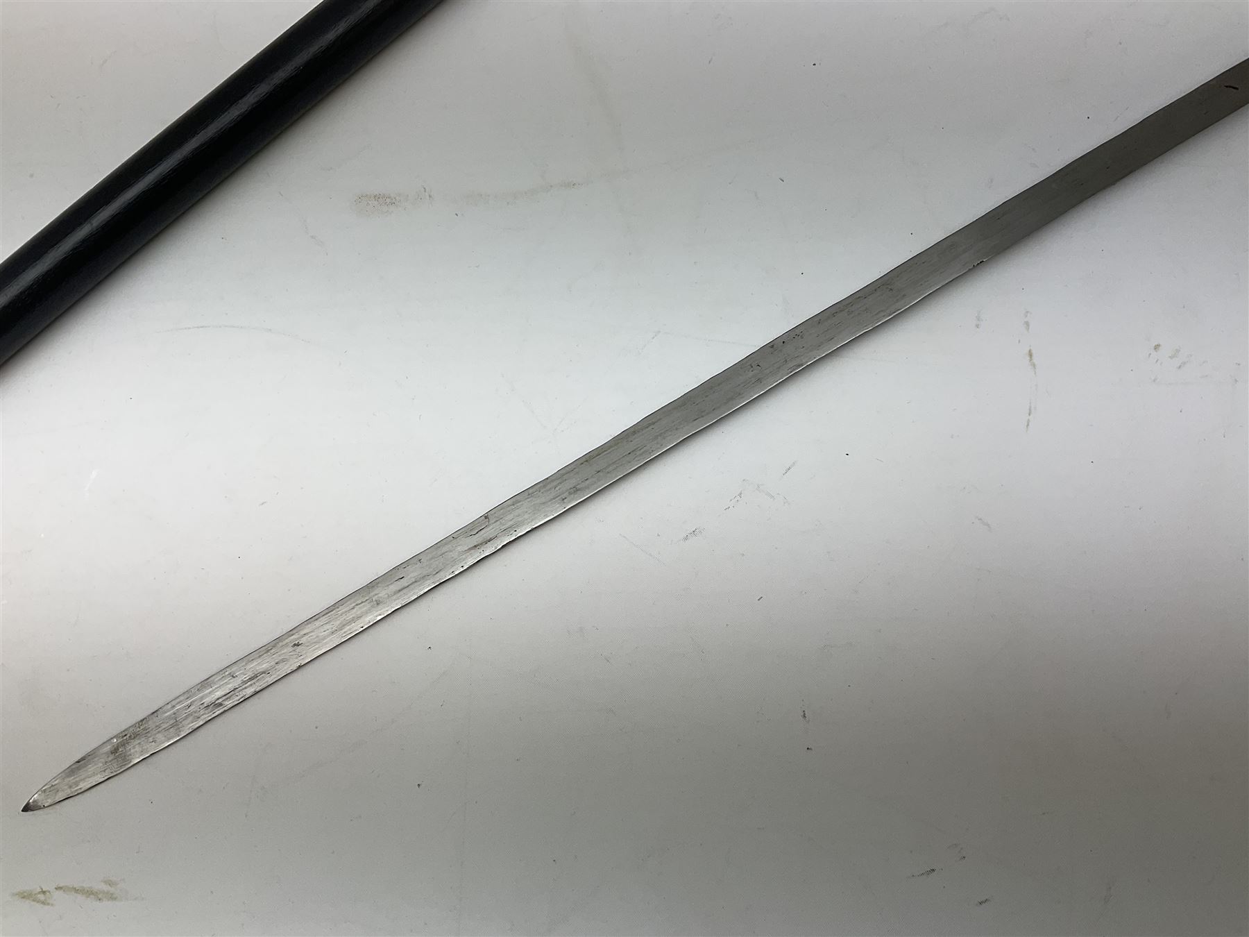 
Late 19th/early 20th century Anglo Indian ebony and bone sword stick with 62cm steel blade, brass locking ferrule and lion mask pommel L92 cm.