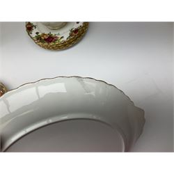 Royal Albert Old Country Roses pattern tea set, comprising teapot, coffee pot, six teacups and six saucers, five side plates, further teacup with joined saucer and side plate, open sucrier, milk jug, cake plate, and preserve pot and cover, together with Royal Albert Jubilee Rose pattern sauce boat and stand, and Royal Albert Lavender Rose pattern cake stand. 