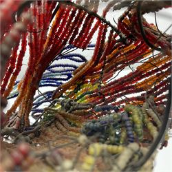 Victorian bead and wire model of a parrot, of polychrome beads, with glass eyes, on a wooden base, H24cm