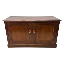 Victorian mahogany cupboard, plain rectangular top above two fielded panel doors opening to shelved interior, raised on a moulded plinth base, with later replacement knob handles