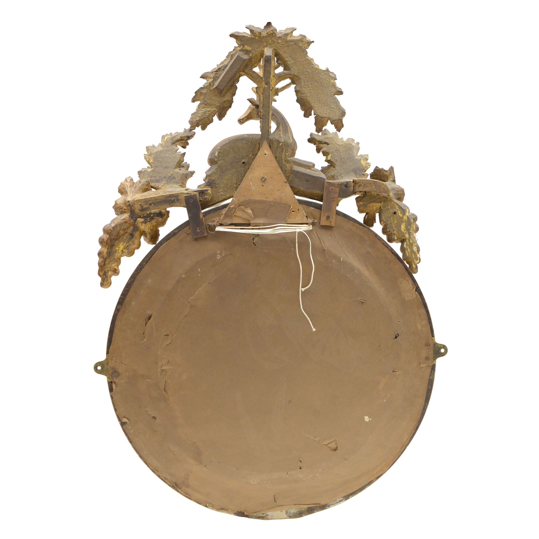 Regency gilt wood and gesso wall mirror, stag pediment with trailing oak leaves and acorns, extending curled acanthus leaves and fruiting vines, the convex mirror plate enclosed by rope twist and acanthus leaf decorated wreath