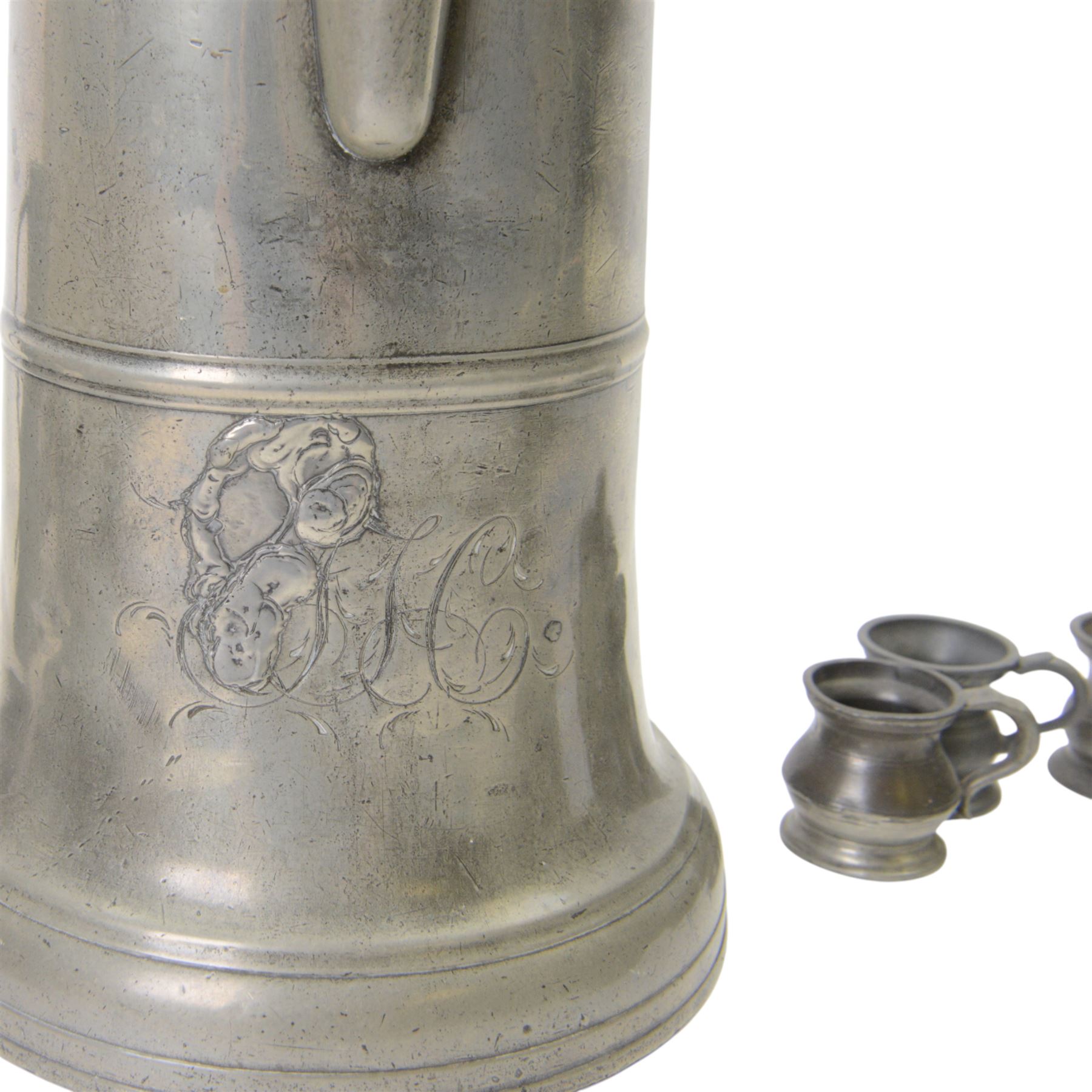 19th century Pewter tavern jug, with WR beneath a crown touch mark, together with pewter tankards and measures  