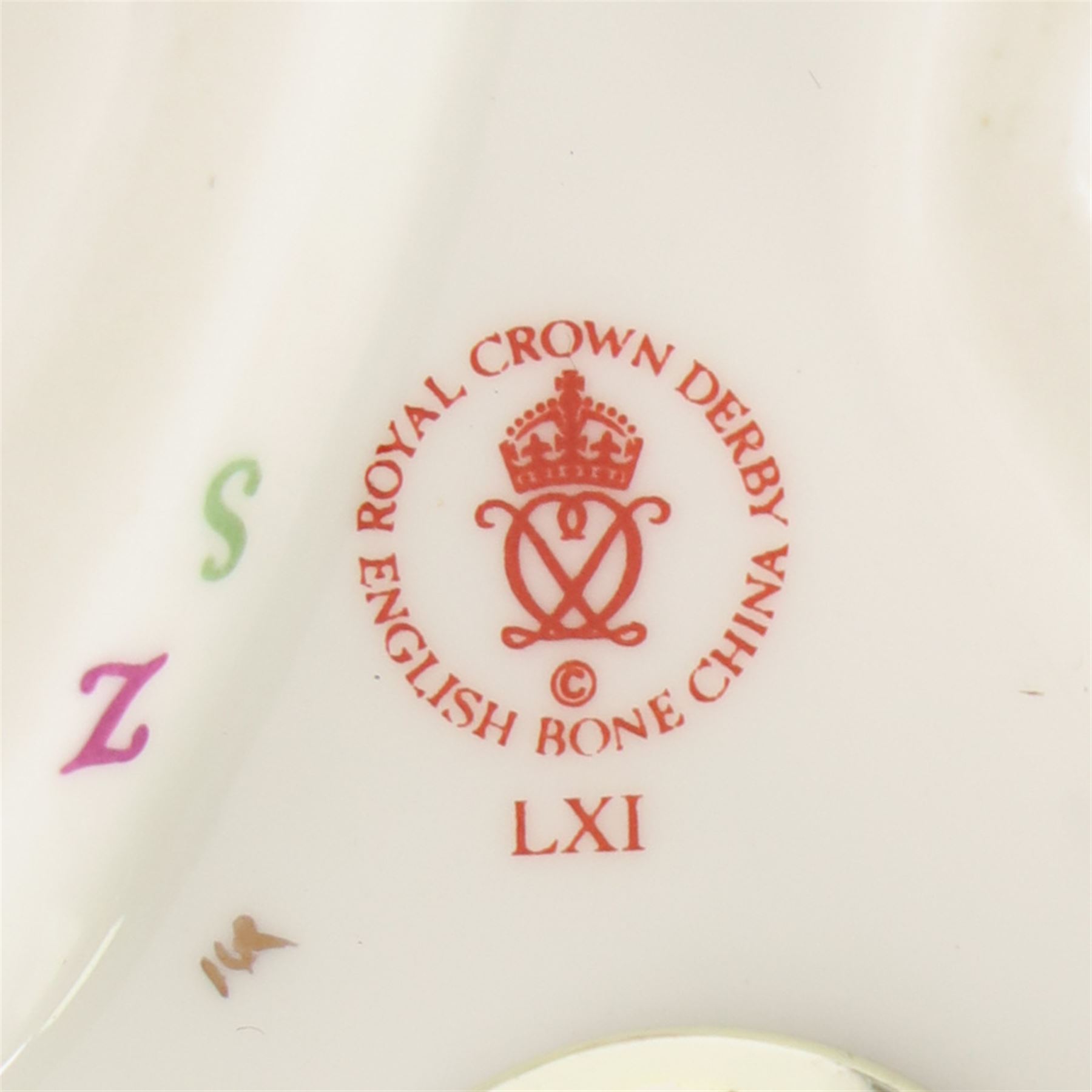 Two Royal Crown Derby paperweights comprising Imari Polar Bear with gold stopper and Sleeping Dormouse, with gold stopper  