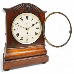 Brooks of London- Regency 8-day rosewood bracket clock c1825, with a serpentine shaped pediment and foliate carving on an ogee stepped base with bun feet, 8