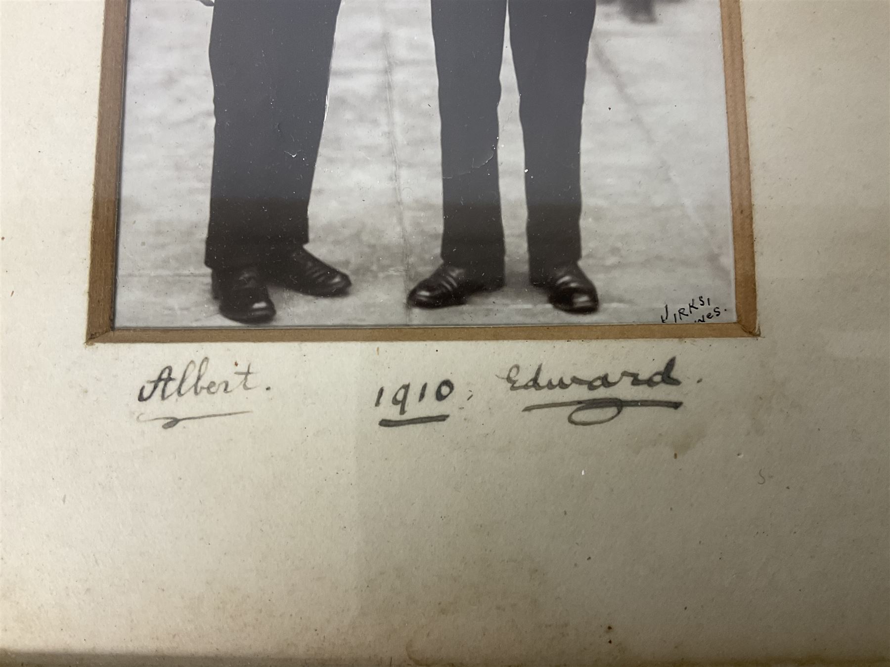 Albert (later George VI) and Edward (later Edward VIII) - postcard size full length photograph of the two Princes in Royal Naval College Osborne uniform aged about fifteen and sixteen; marked Kirks Cowes; framed with contemporary mount signed by each brother and dated 1910, 12 x 8cm