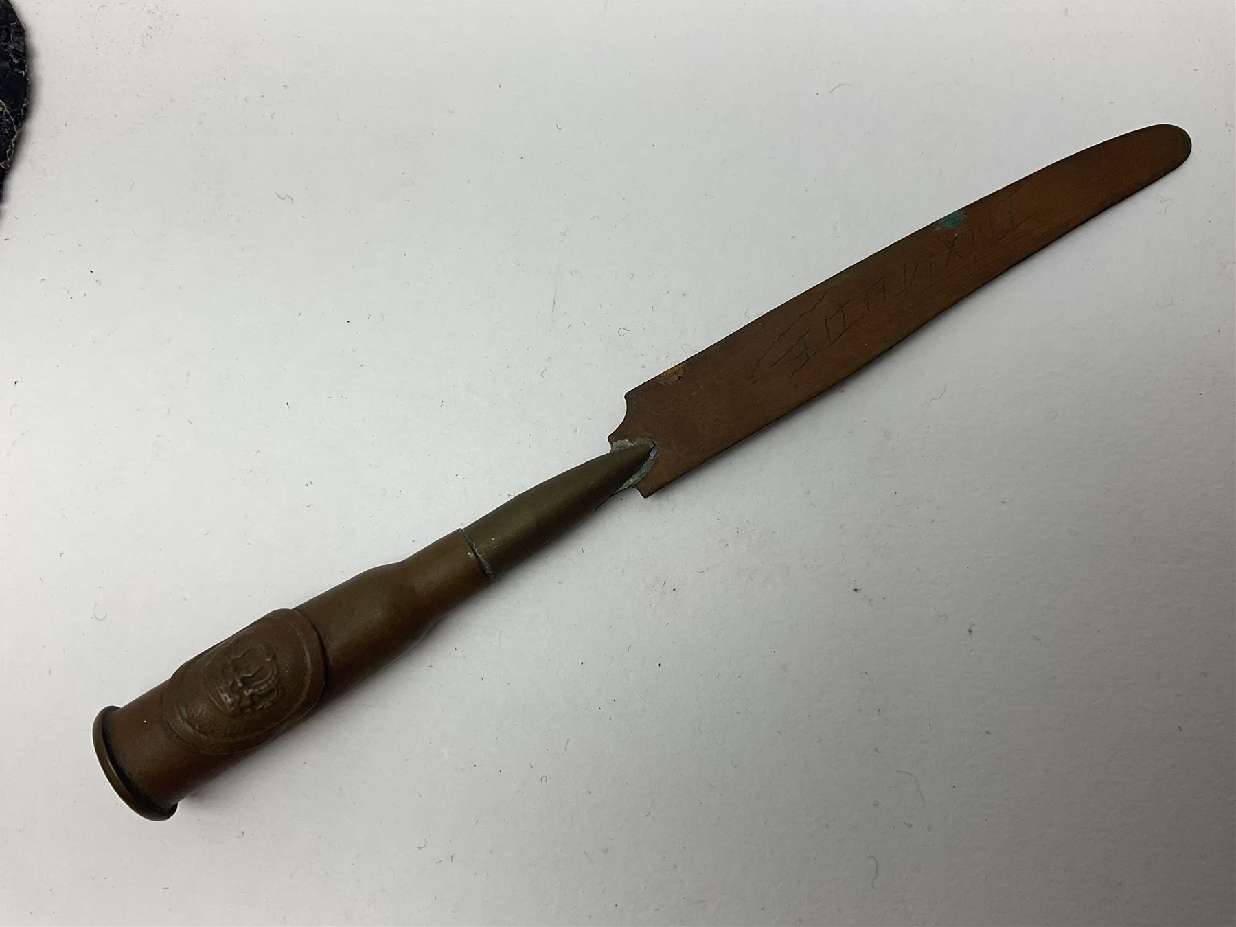 WW1 Short & Mason Ltd 'The Magnapole' black japanned brass field compass in leather carrying case; WW1 trench art paper knife inscribed Dixmude; and small quantity of cloth badges etc