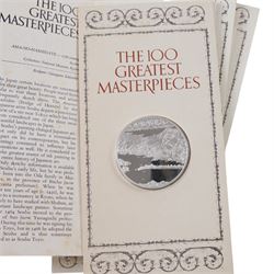 John Pinches 'The 100 Greatest Masterpieces' set of one hundred silver medallions, each on presentation card with information leaflet, together with the corresponding wooden display cabinet