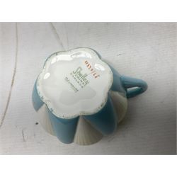 Shelley Dainty pattern tea wares, of lobed form with blue star decoration on merging white and yellow ground, comprising five teacups, five saucers, six tea plates, milk jug and cake plate, all with printed green mark beneath, some with painted pattern no 11770