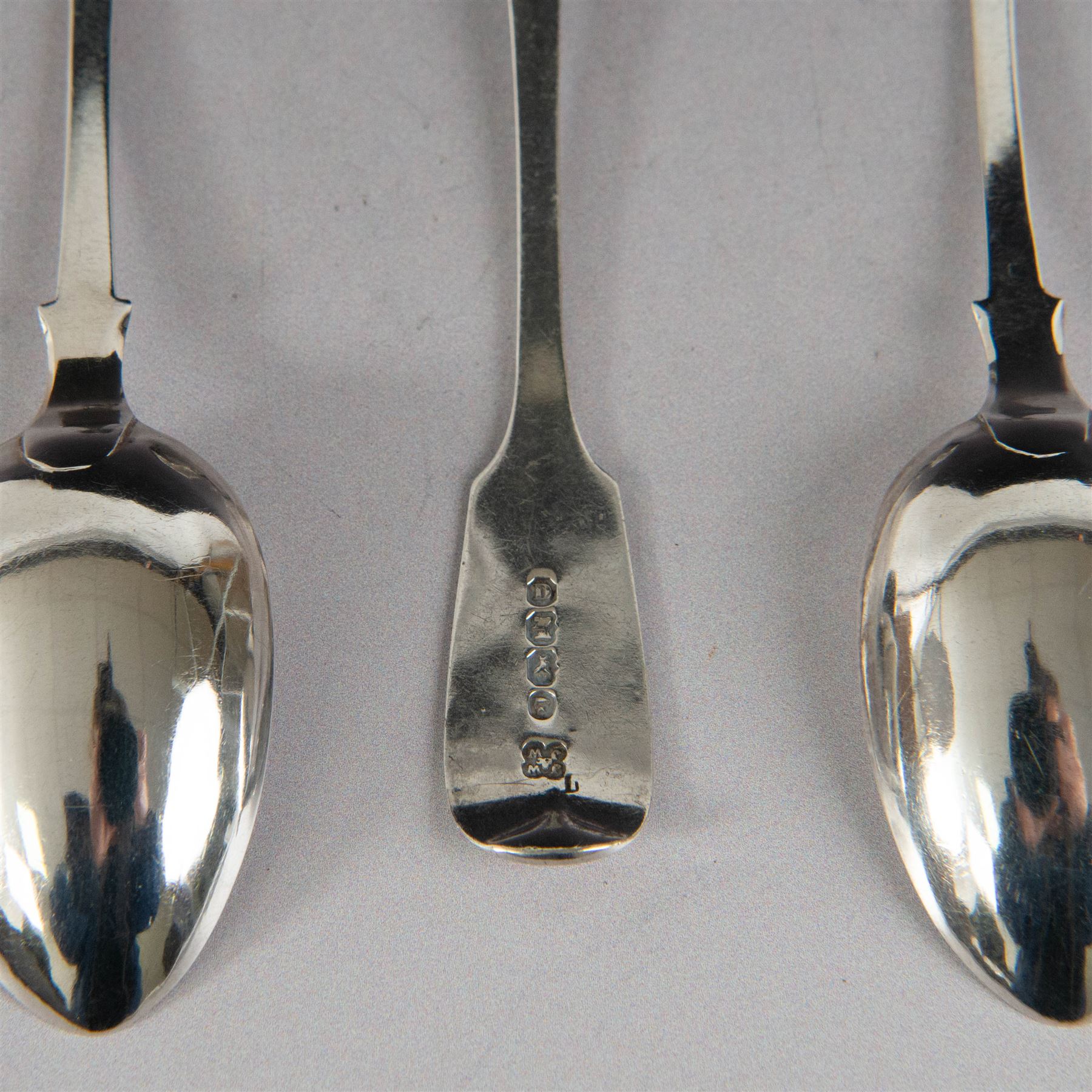 Set of twelve Victorian Exeter silver Fiddle pattern teaspoons, all with engraved initials to terminal, hallmarked Josiah Williams & Co, Exeter 1860, contained within tooled leather case with burgundy silk and velvet lined interior
