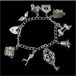 Silver charm bracelet including house, car, phone, rugby player and bridge