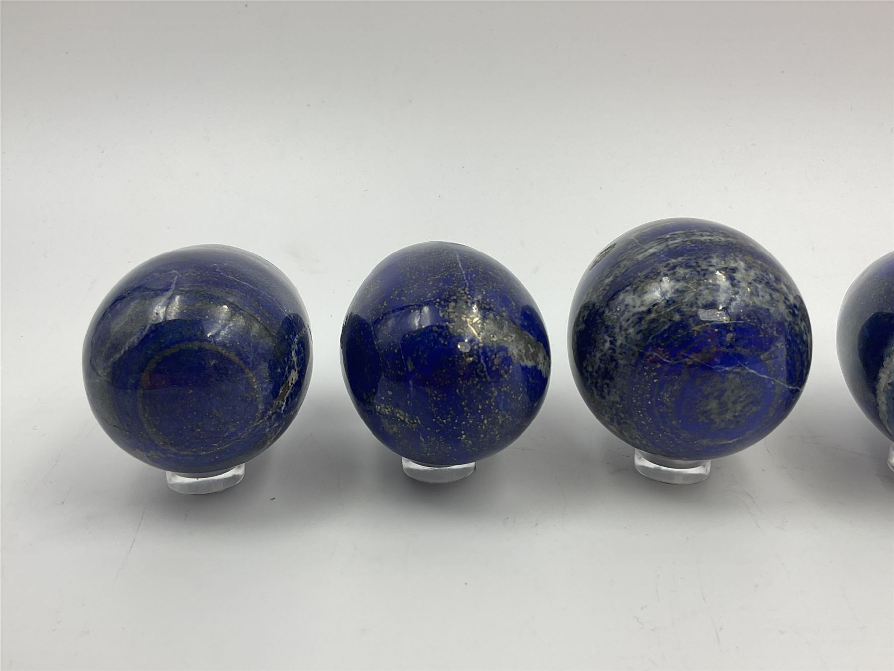 Collection of five Lapis lazuli specimen eggs, largest egg H7cm