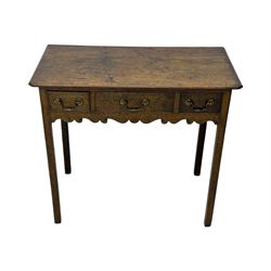 18th century oak lowboy, rectangular moulded top over three frieze drawers with brass swing handles, scalloped apron, on slender square section supports