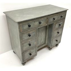Contemporary knee hole desk, rectangular top over eight drawers and cupboard, grey painted and clear wax finish