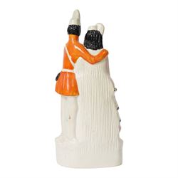 Rare Staffordshire figure group, Princess Helena and Prince Christian of Schleswig-Holstein, circa 1866, she with right arm across chest holding a fan, wearing a plumed hat, he with arm around her shoulder, wearing military uniform, H30.5cm