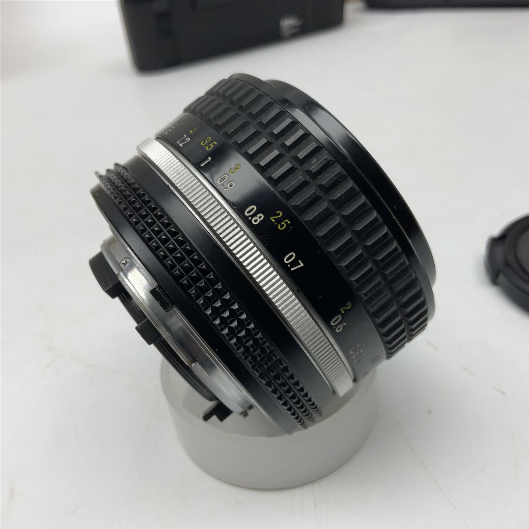 Nikon F3T camera body, in champagne/ titanium colourway, serial no. T8215031, with 'Nikon Nikkor 50mm 1:1.4' lens, Nikon MD4 motor drive, serial no. 156592 and Nikon MK-1 Firing range converter, all with original boxes 