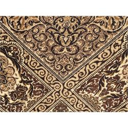 Persian Tabriz ivory ground rug, the field centred by a shaped floral medallion with swirling spandrels, richly decorated with foliate motifs, the broad border with matching cartouches and palmettes, within multiple guard stripes